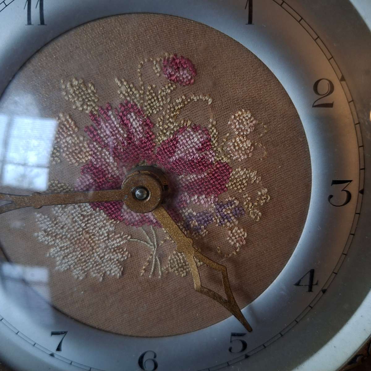 Mechanical Table Clock with petit point face - made in england.  Filigree metal feet.  Working
