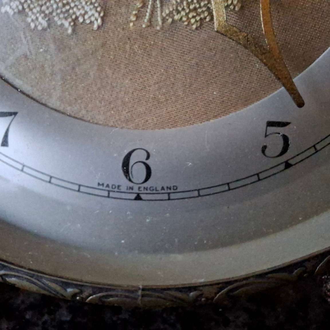 Mechanical Table Clock with petit point face - made in england.  Filigree metal feet.  Working