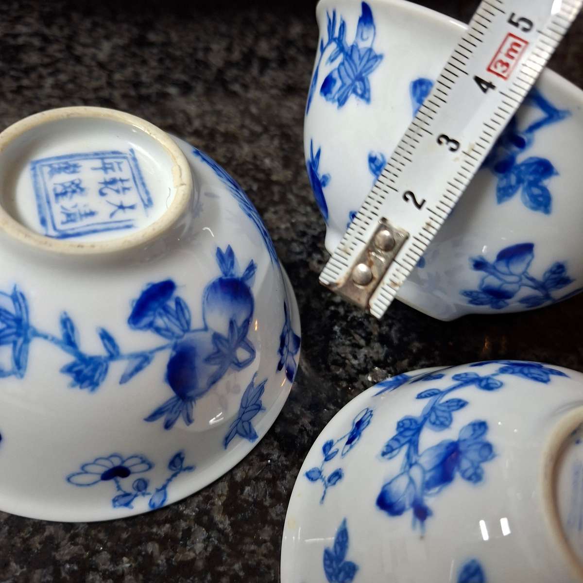 3 Oriental tea bowls - blue and white floral design