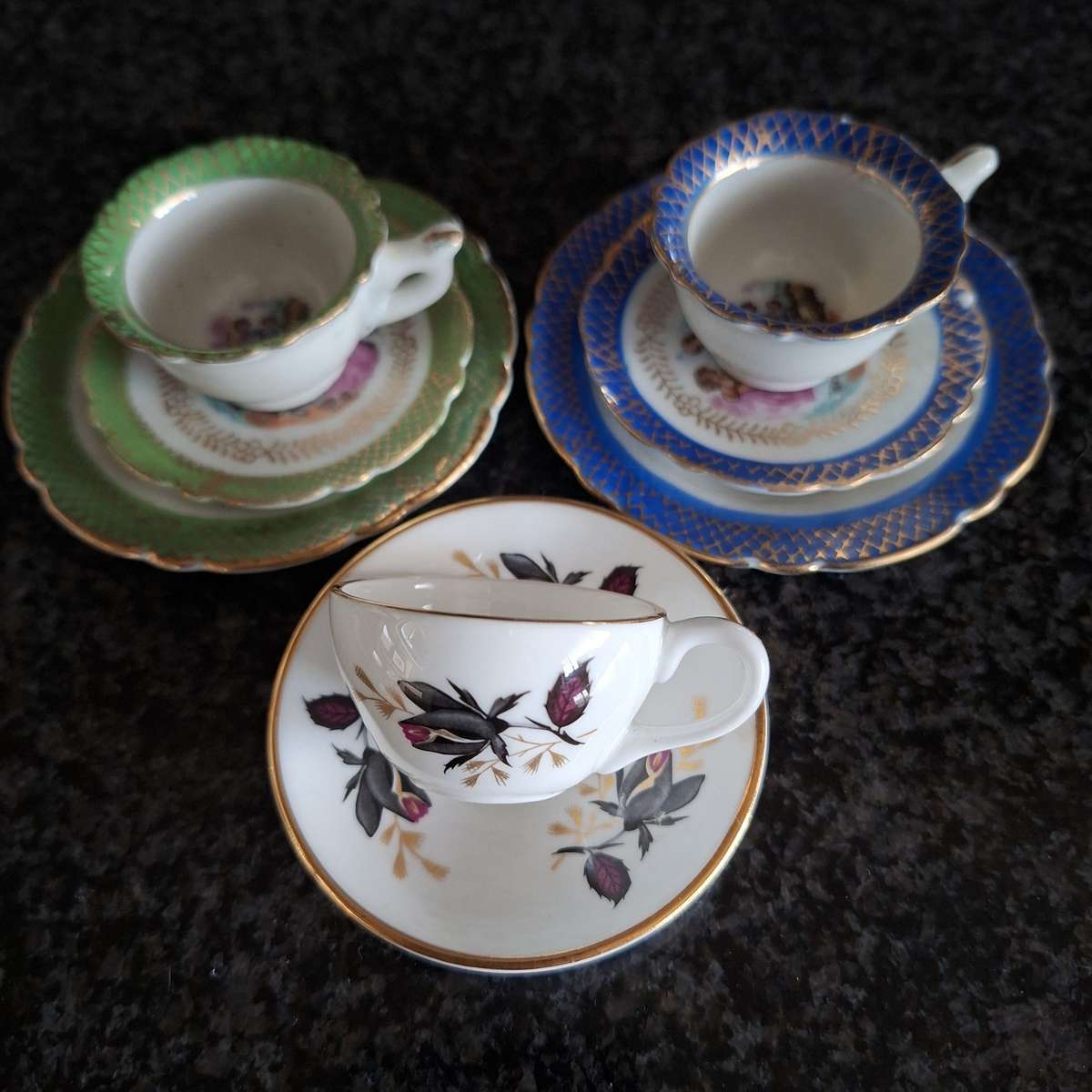 mini tea cup trios and 1 duo Tea cup