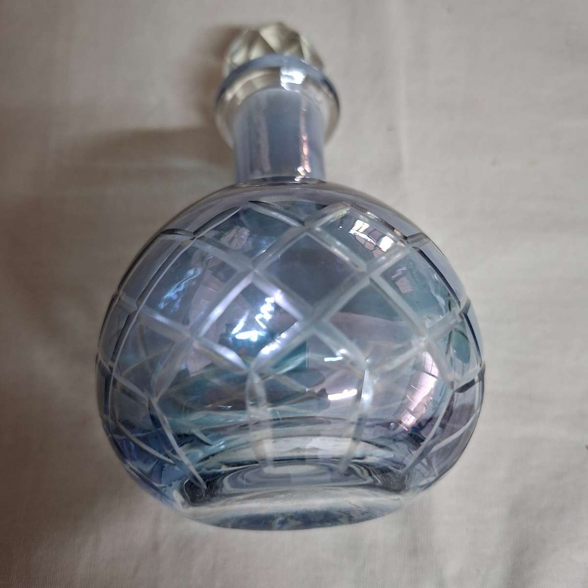 2 perfume bottles approx 16 cms tall - stamped gero. Cut crystal stoppers