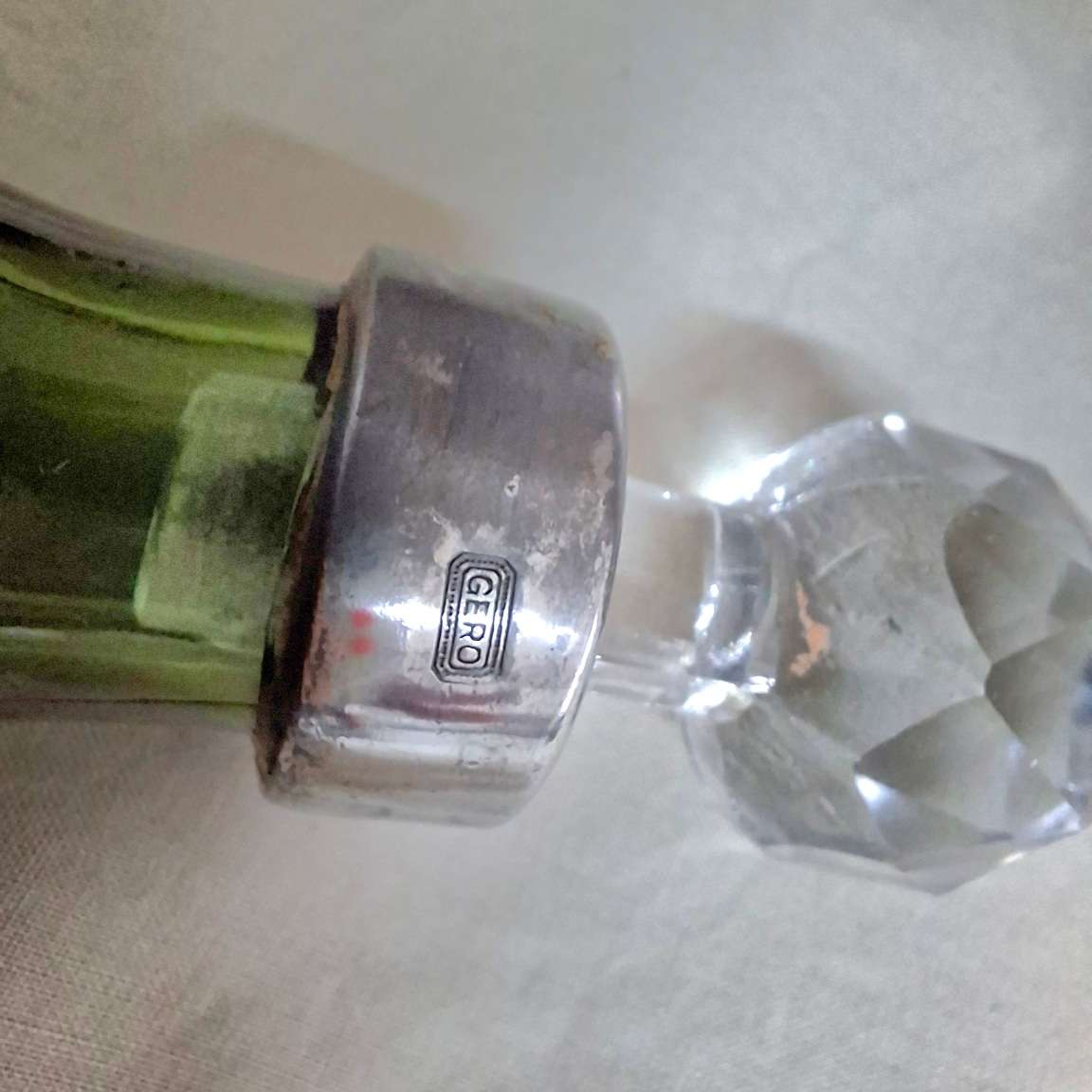 2 perfume bottles approx 16 cms tall - stamped gero. Cut crystal stoppers