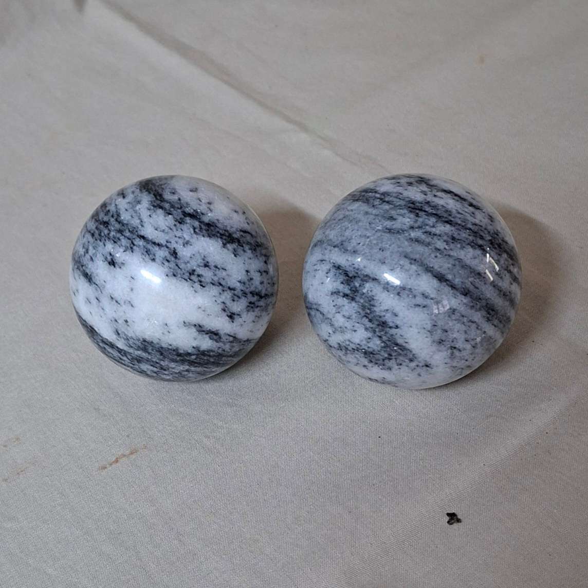 2 Polished marble decorative spheres, balls.