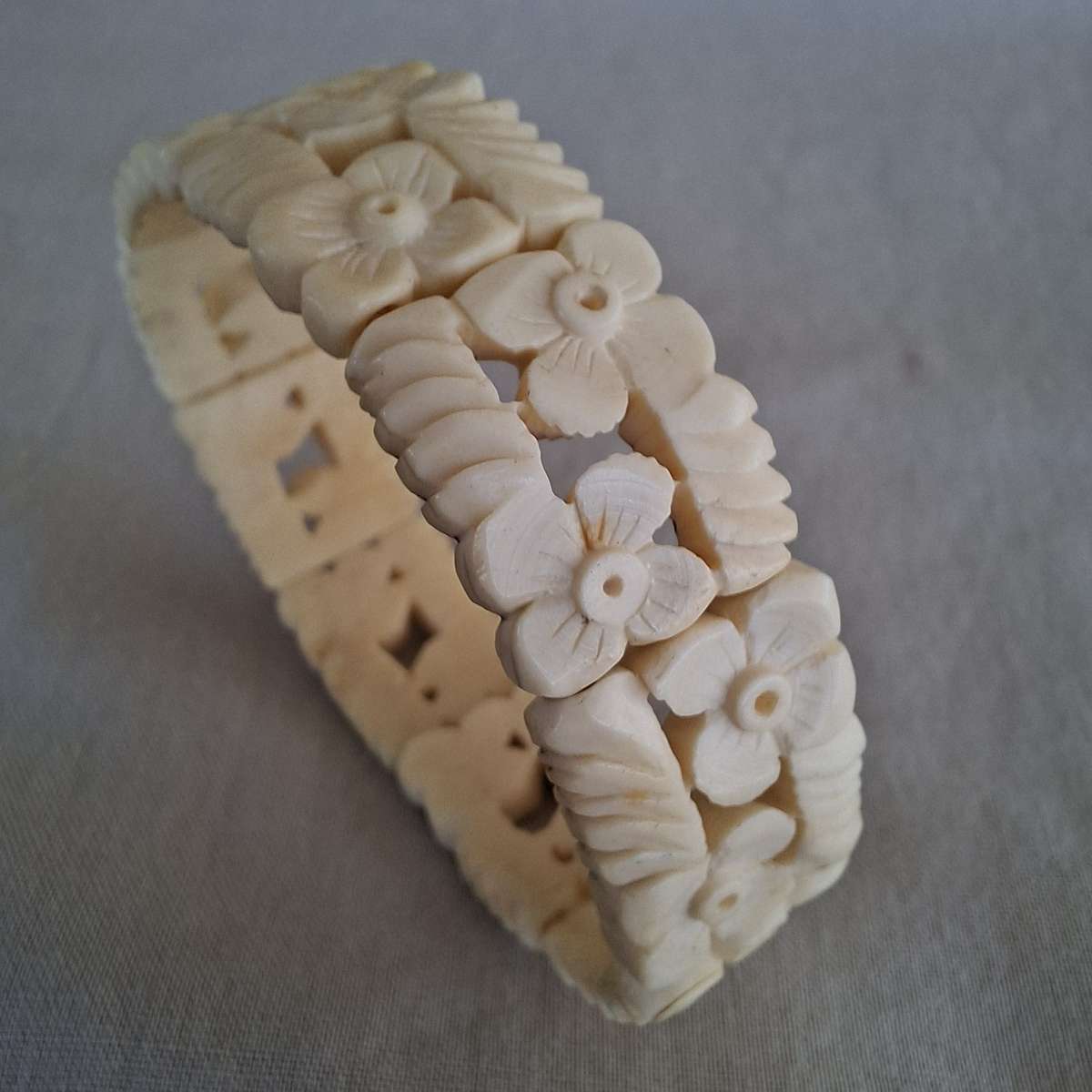Carved cream coloured floral bangle, bracelet - bone?