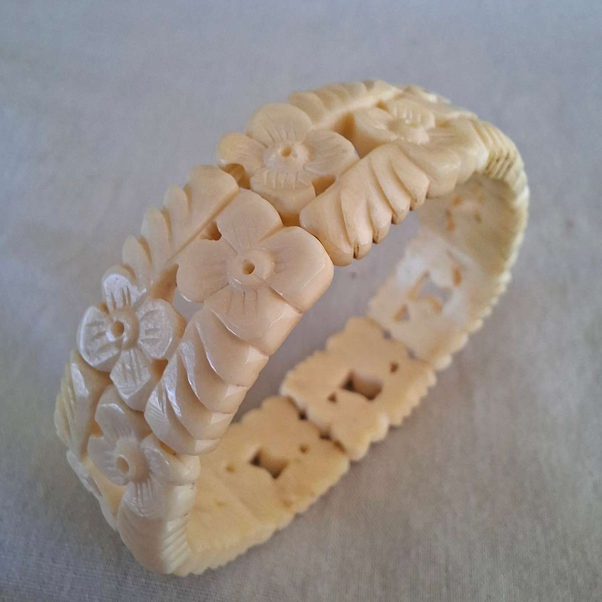 Carved cream coloured floral bangle, bracelet - bone?