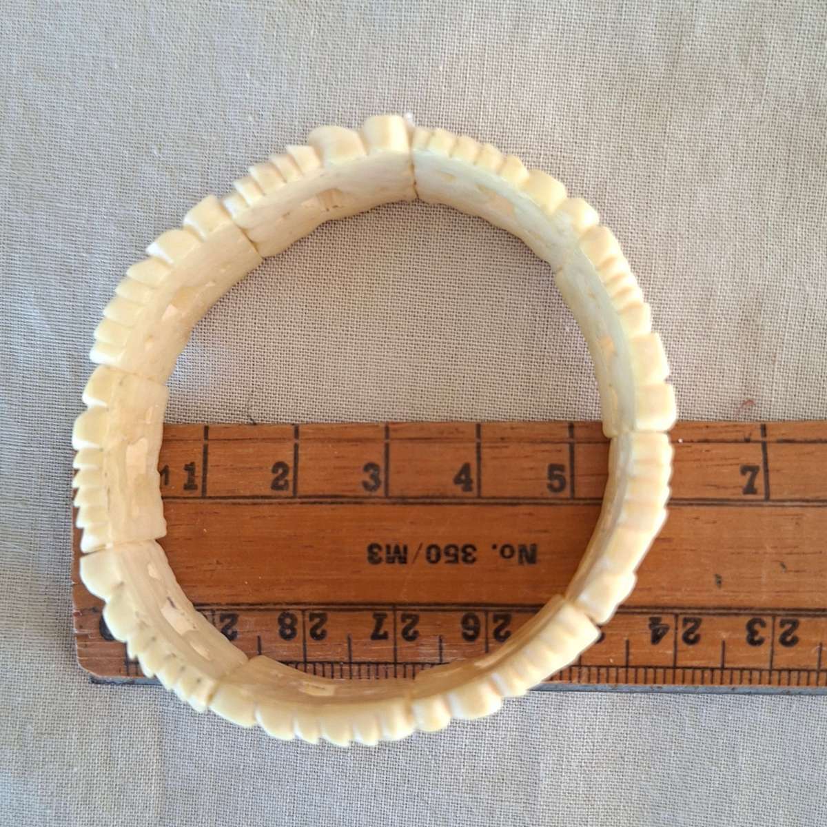 Carved cream coloured floral bangle, bracelet - bone?