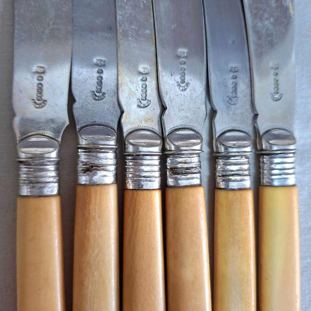 12 Fish knives and forks Silver hallmarked collars - bone or ivorine handles - etched