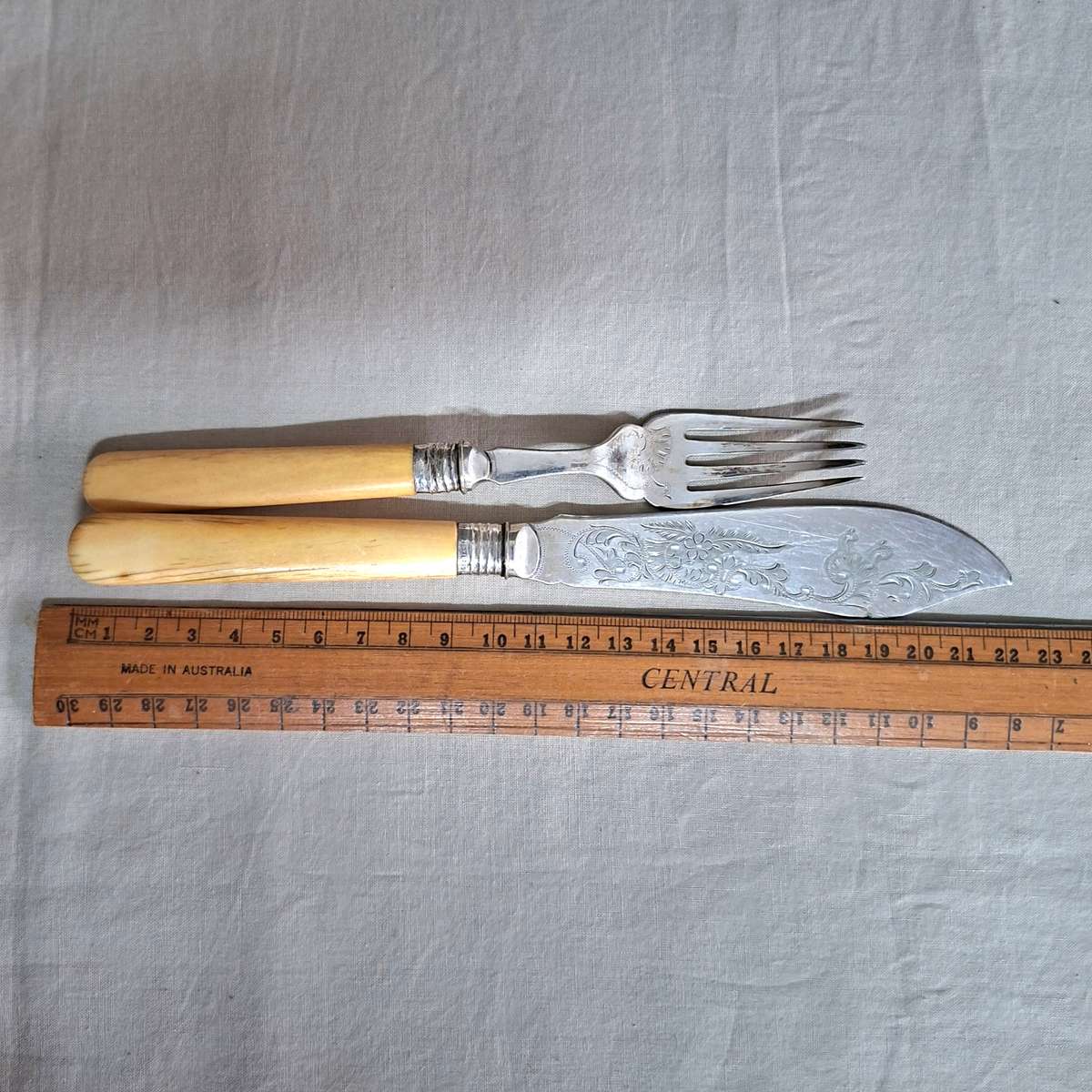 12 Fish knives and forks Silver hallmarked collars - bone or ivorine handles - etched
