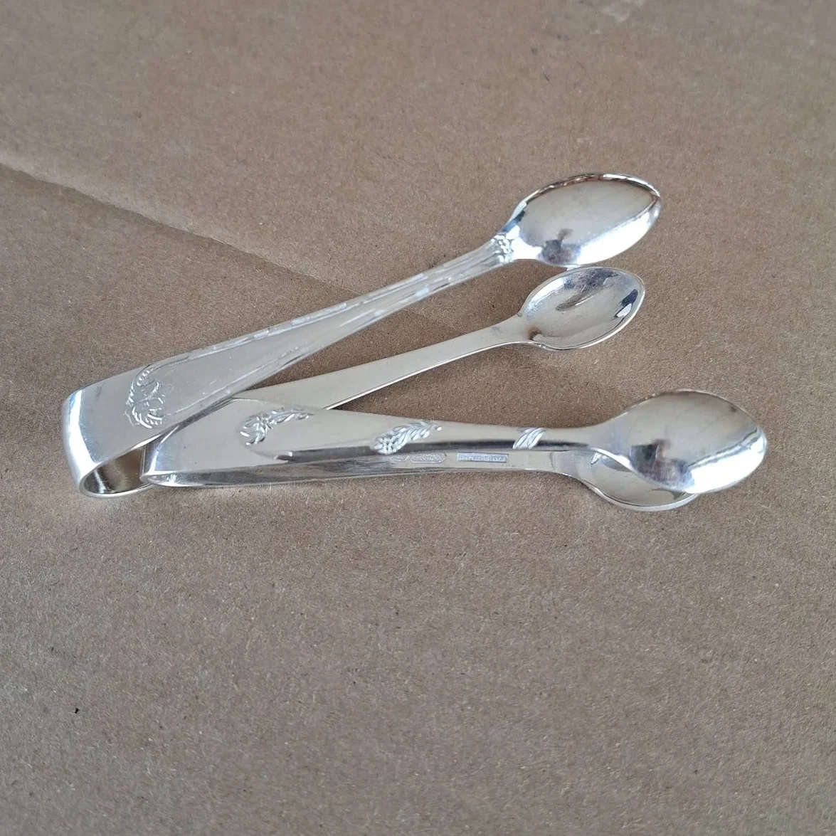 2 silver plate sugar tongs vintage