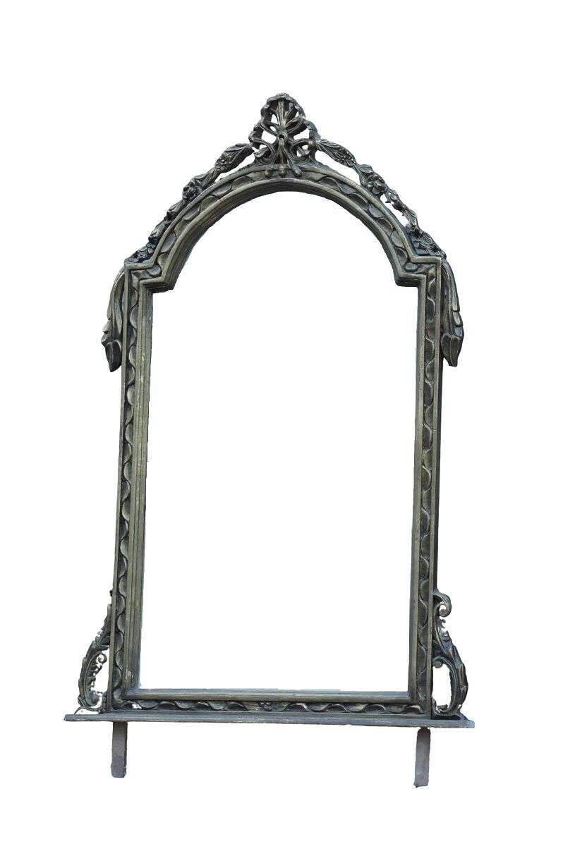 An Ornately Carved and Bevelled Gilded Mirror