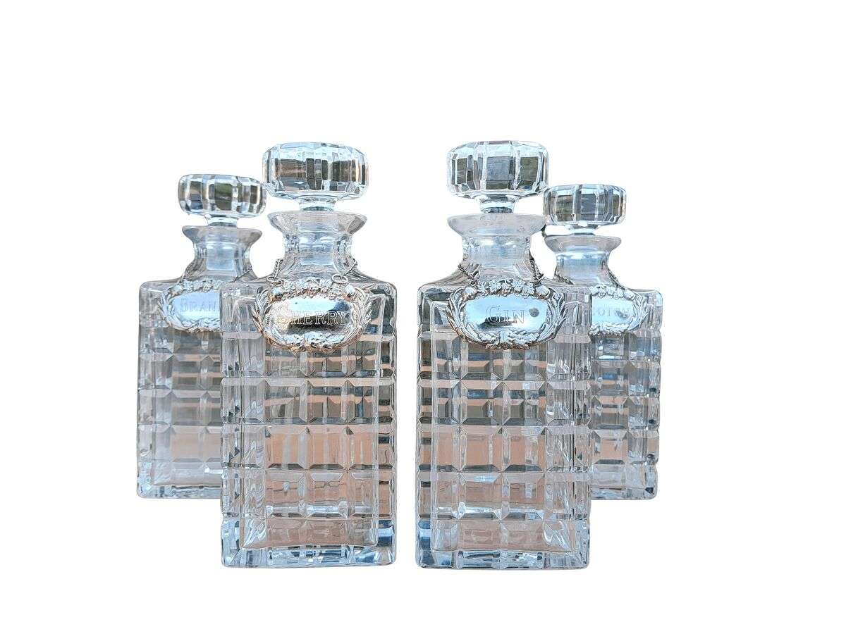 A Set of Four Decanters With Silver-plate Labels (Brandy, Scotch, Sherry, Gin)