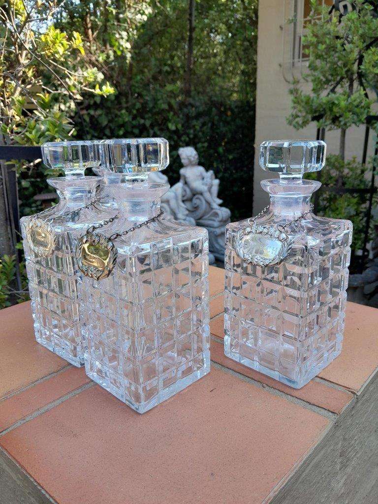 A Set of Four Decanters With Silver-plate Labels (Brandy, Scotch, Sherry, Gin)
