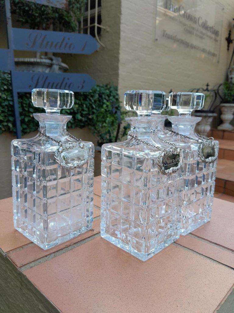 A Set of Four Decanters With Silver-plate Labels (Brandy, Scotch, Sherry, Gin)