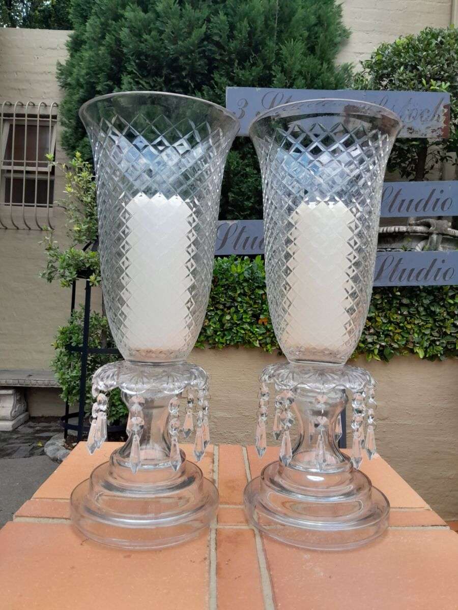 A Pair Of French Style Candle Holders With Candles