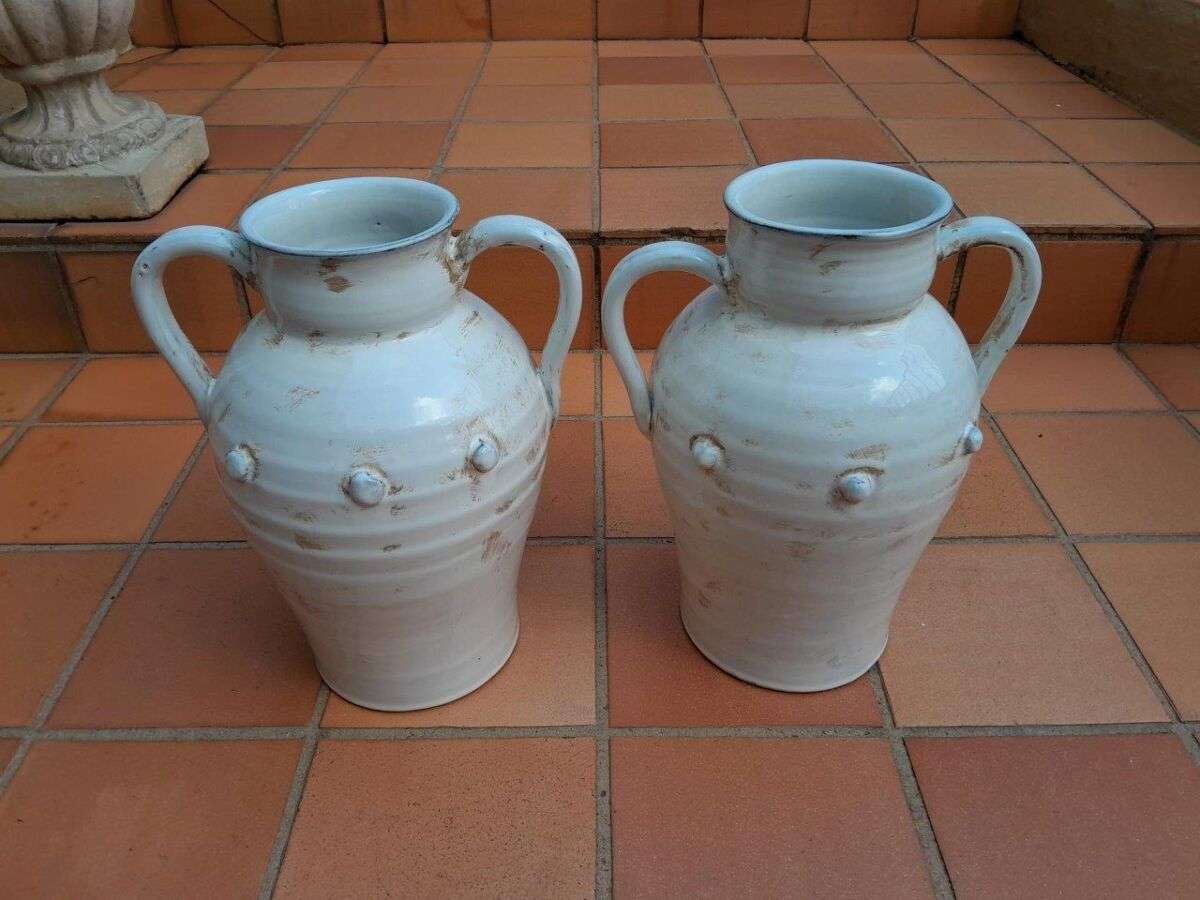 A Pair Of Large Ceramic Urns With Two Handles