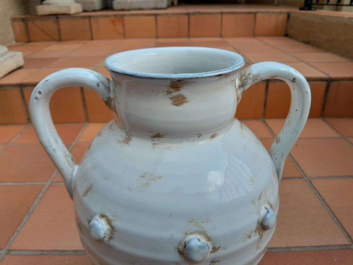 A Pair Of Large Ceramic Urns With Two Handles