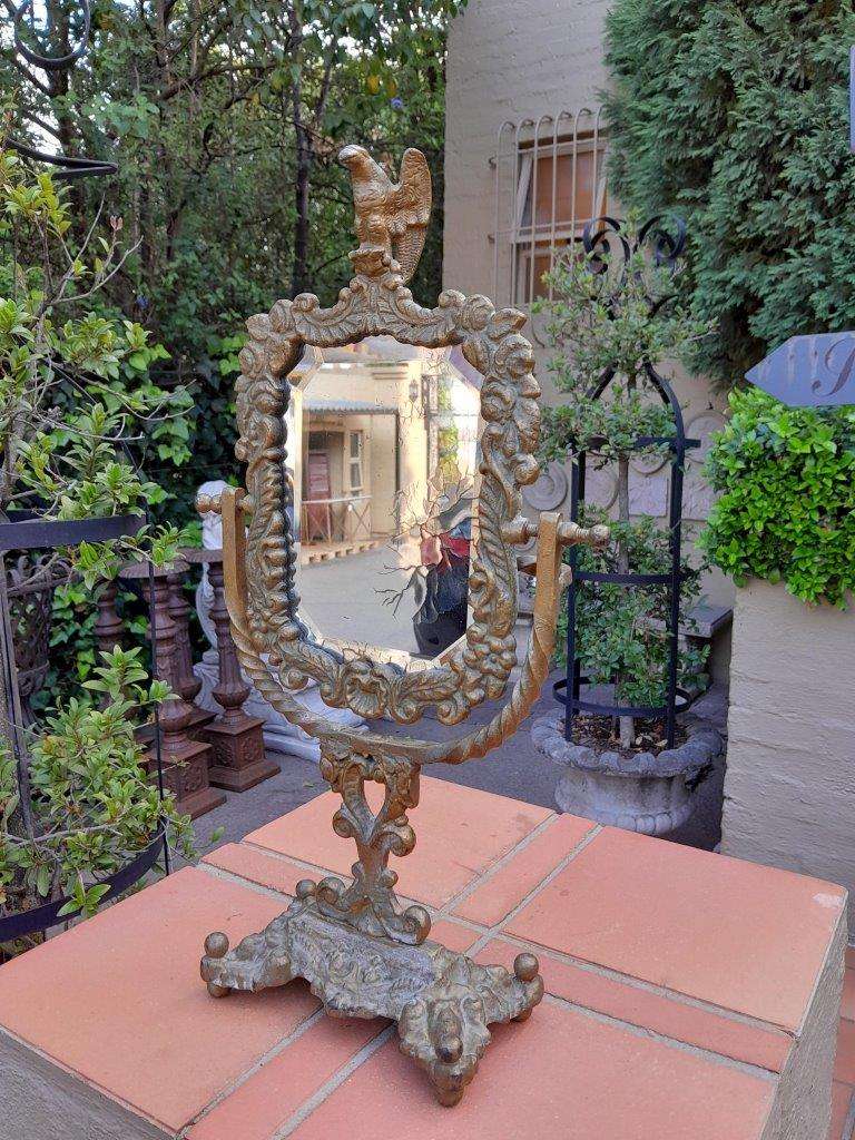 A Victorian Style Brass Bevelled Table Aged Mirror  In An Antique Gold Paint Finish