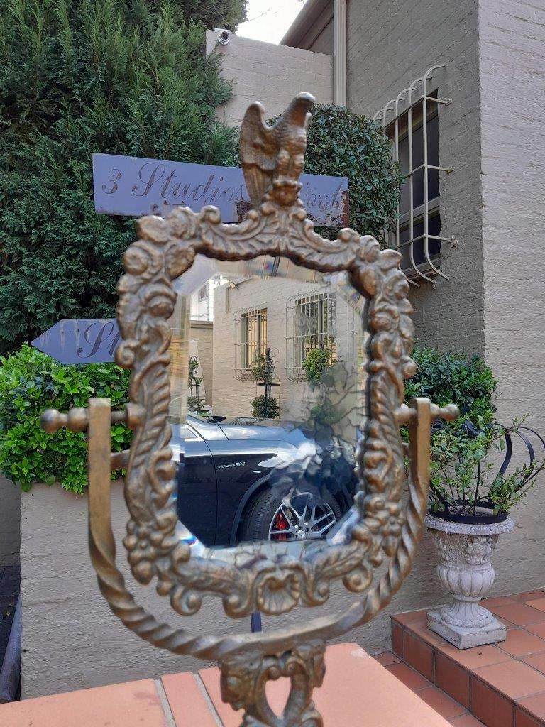 A Victorian Style Brass Bevelled Table Aged Mirror  In An Antique Gold Paint Finish