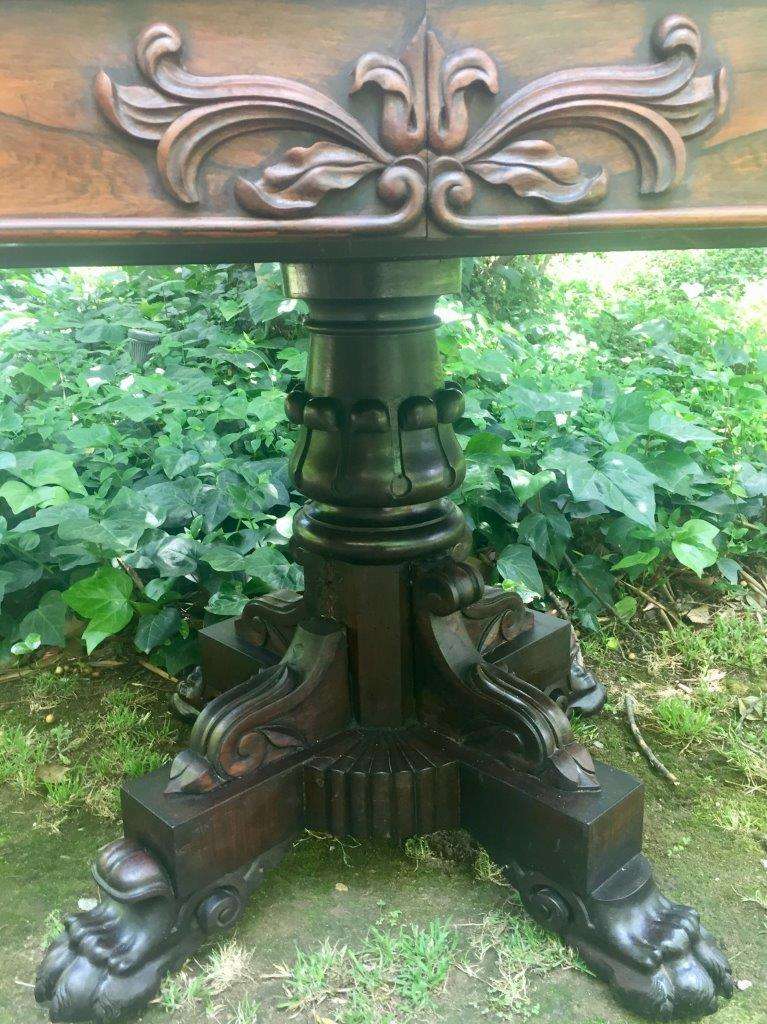 Victorian rosewood library table with two drawers on castors