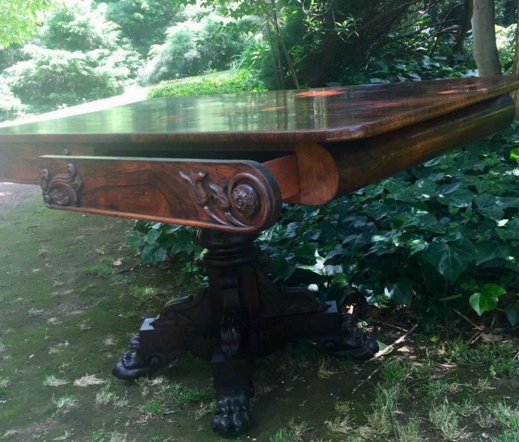 Victorian rosewood library table with two drawers on castors