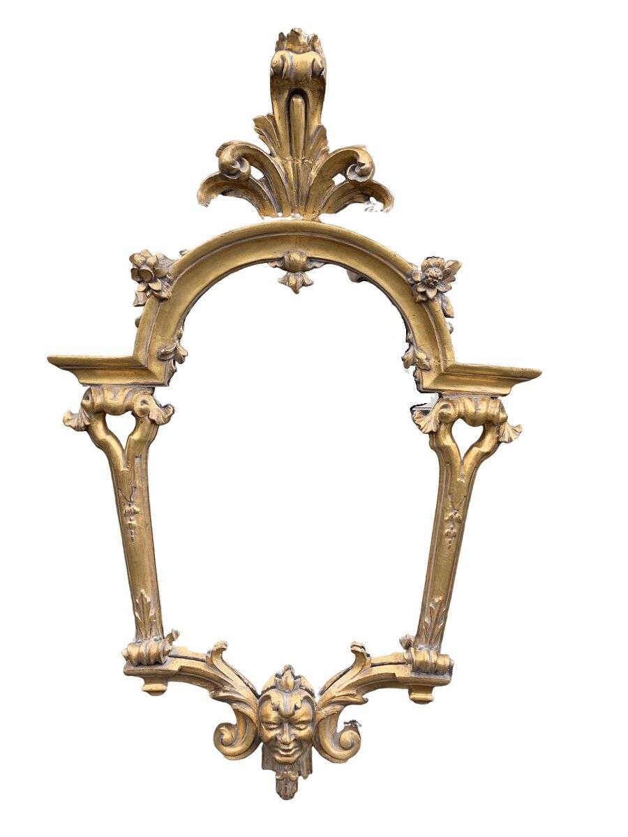 Ornately carved and gilded mirror