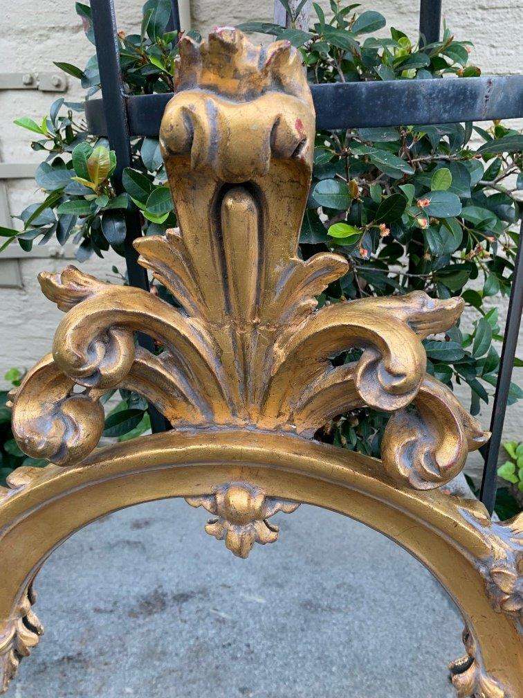 Ornately carved and gilded mirror