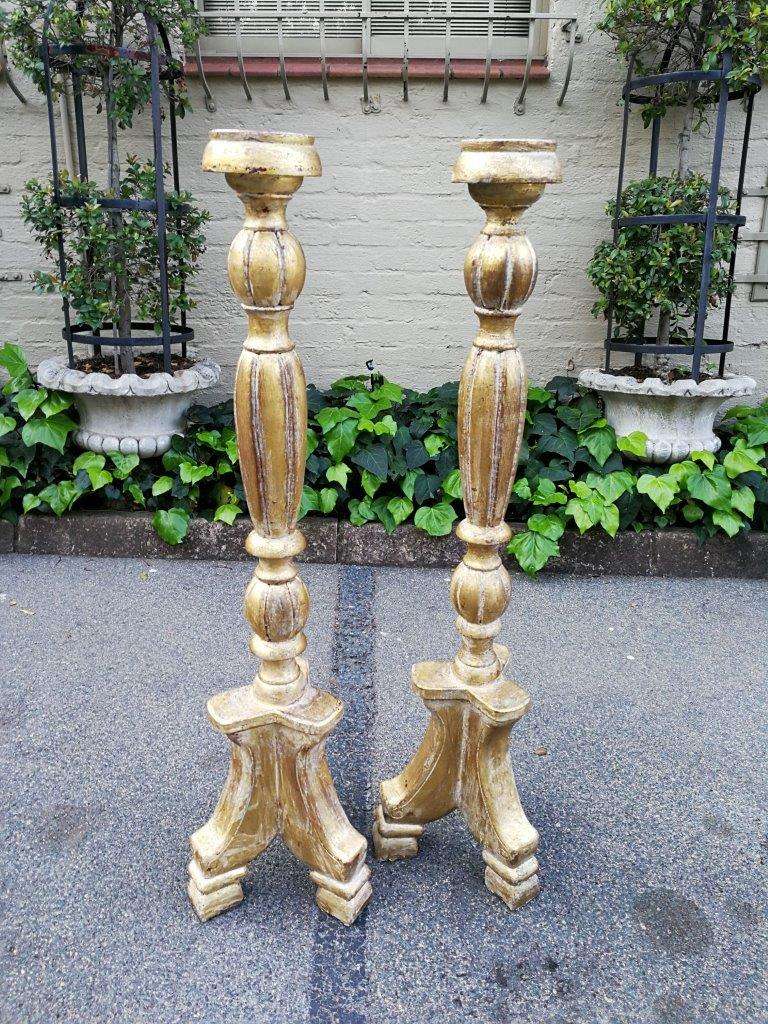 A Pair Of Carved Wooden Candle Holders Hand Gilded With Gold Leaf
