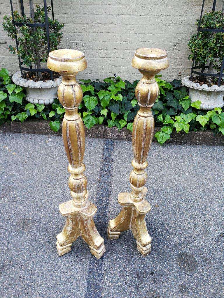 A Pair Of Carved Wooden Candle Holders Hand Gilded With Gold Leaf
