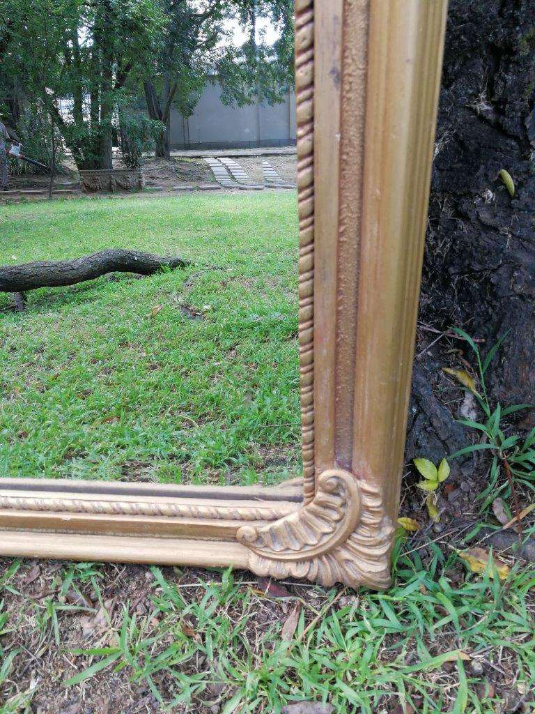 Ornately Carved Oval Gilded Mirror