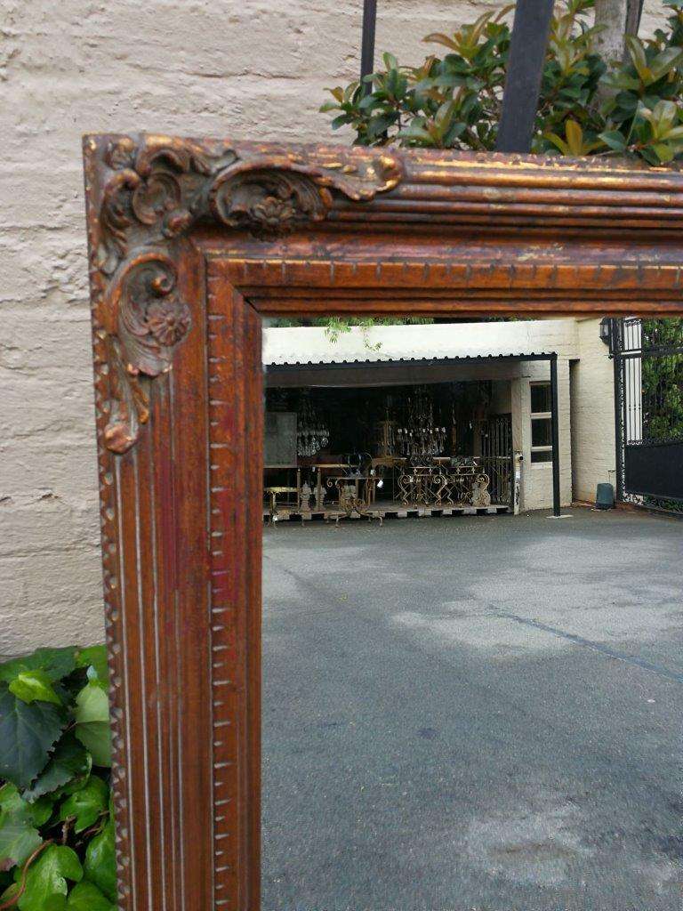 A vintage wooden gilded mirror