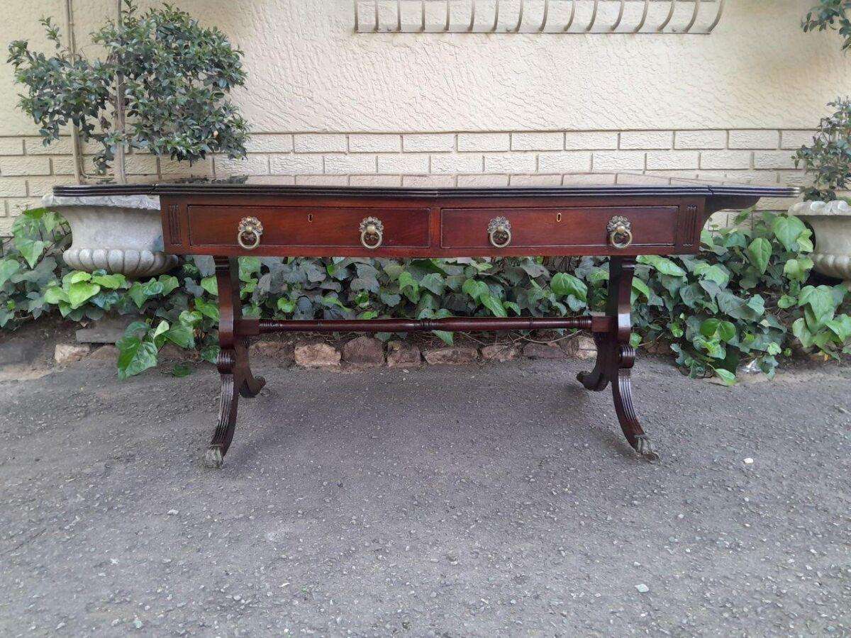 A Victorian Circa 1870, Mahogany Drop-side Library Table, With Drawers and Brass Escurcheons (the...