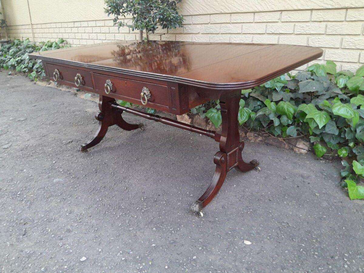 A Victorian Circa 1870, Mahogany Drop-side Library Table, With Drawers and Brass Escurcheons (the...