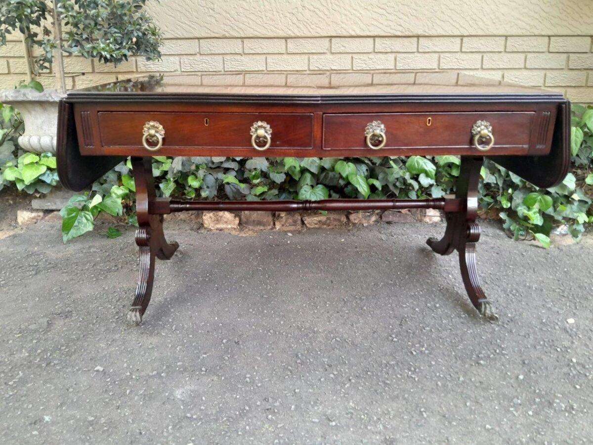 A Victorian Circa 1870, Mahogany Drop-side Library Table, With Drawers and Brass Escurcheons (the...