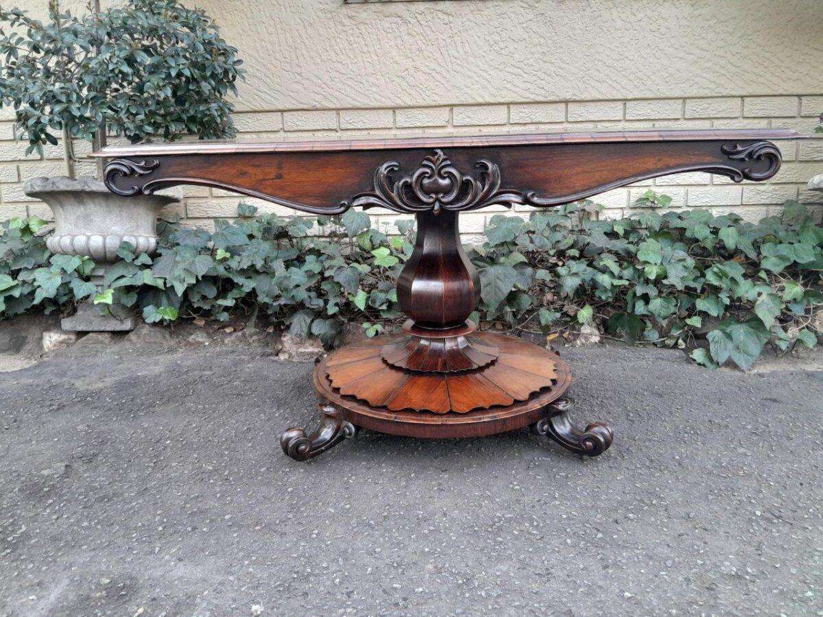 An Antique Victorian Rosewood Sofa Table on Castors