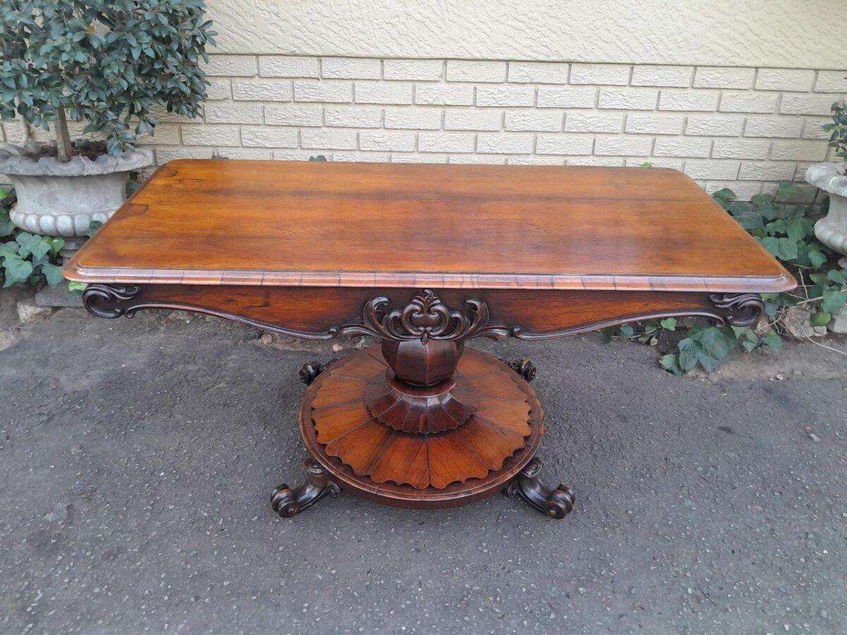 An Antique Victorian Rosewood Sofa Table on Castors