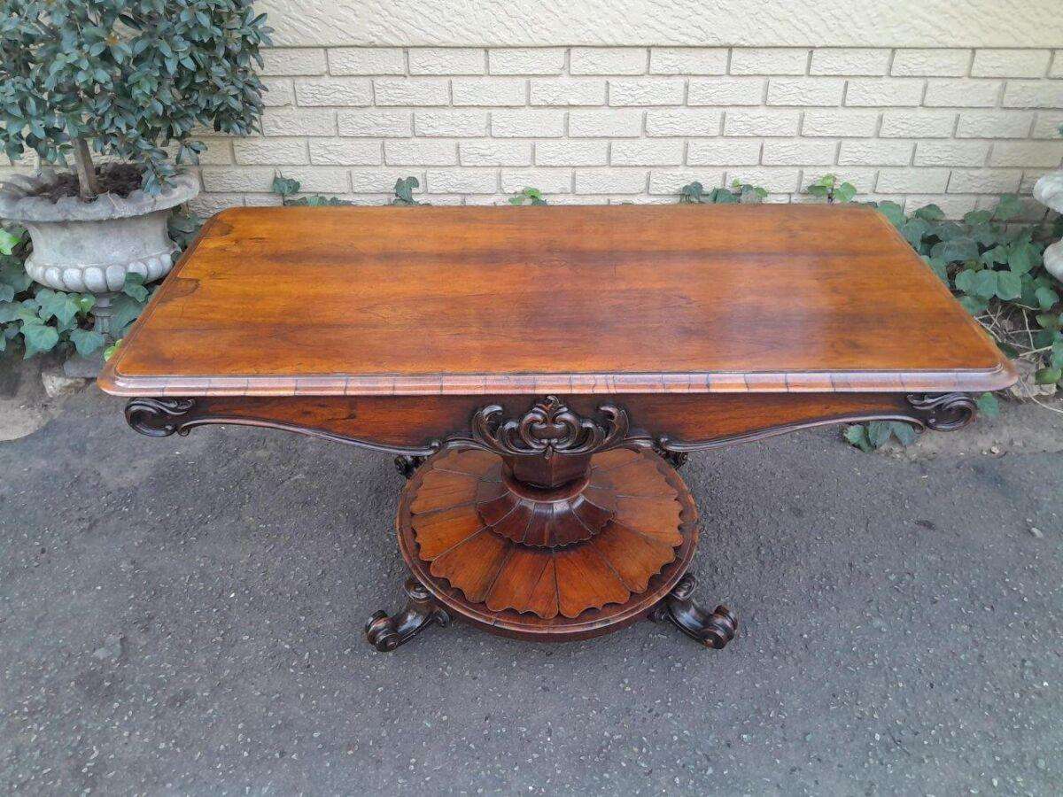 An Antique Victorian Rosewood Sofa Table on Castors