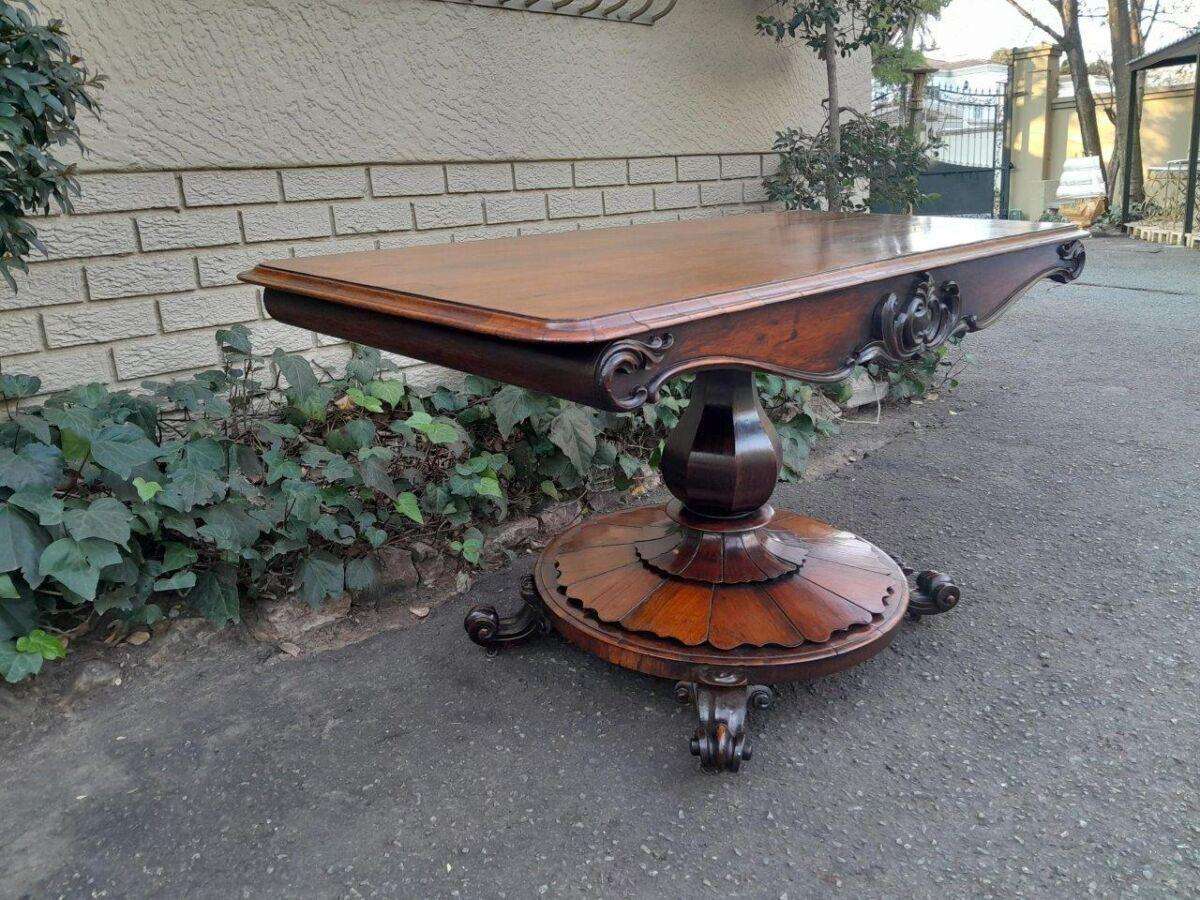 An Antique Victorian Rosewood Sofa Table on Castors