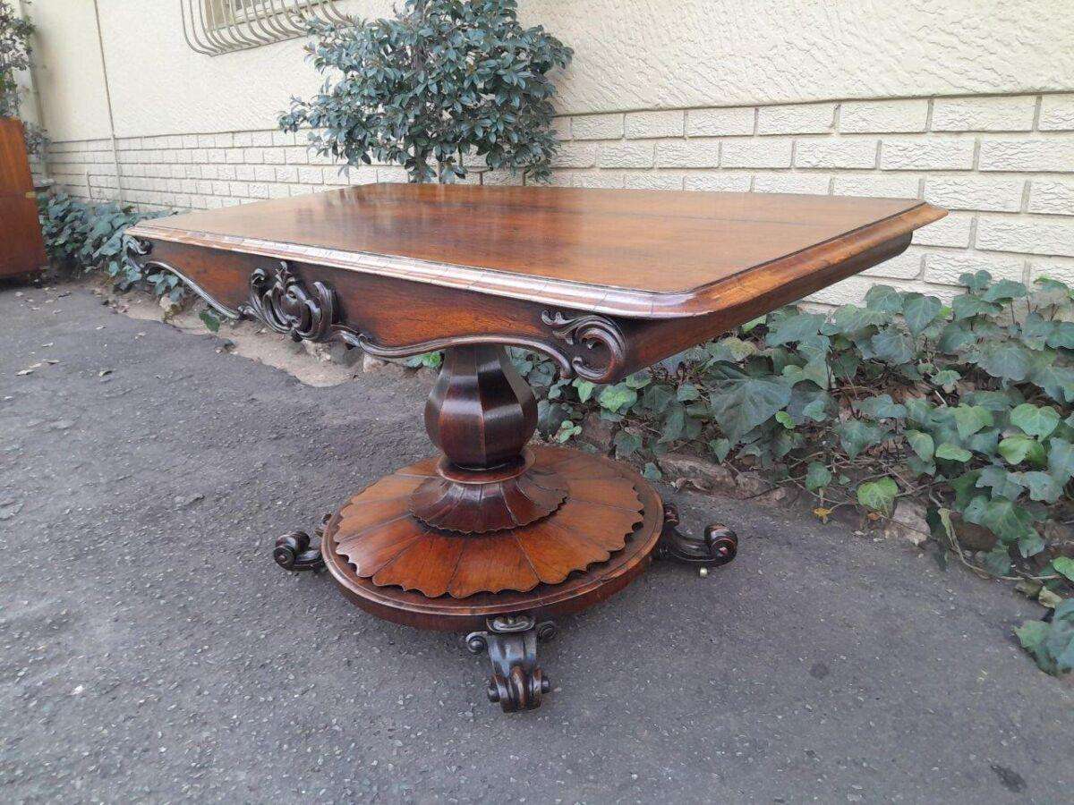 An Antique Victorian Rosewood Sofa Table on Castors