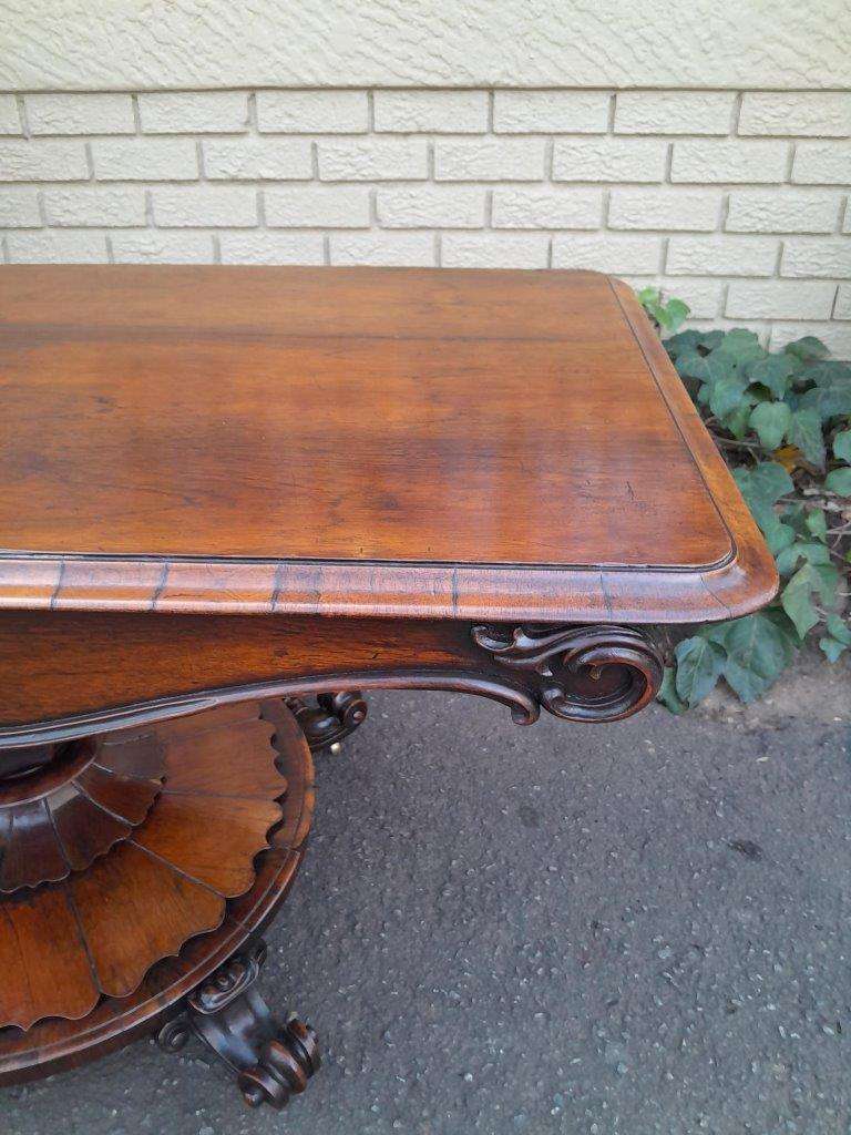An Antique Victorian Rosewood Sofa Table on Castors
