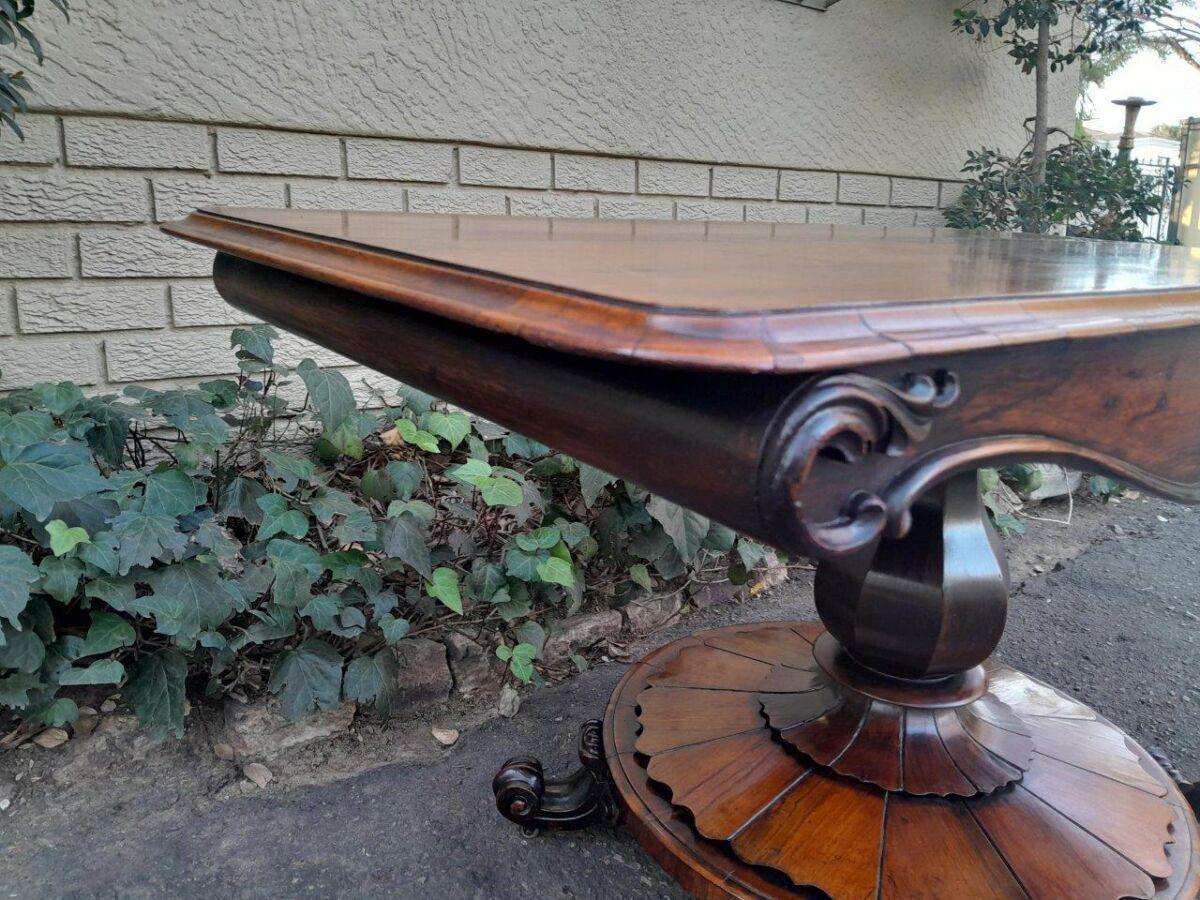 An Antique Victorian Rosewood Sofa Table on Castors