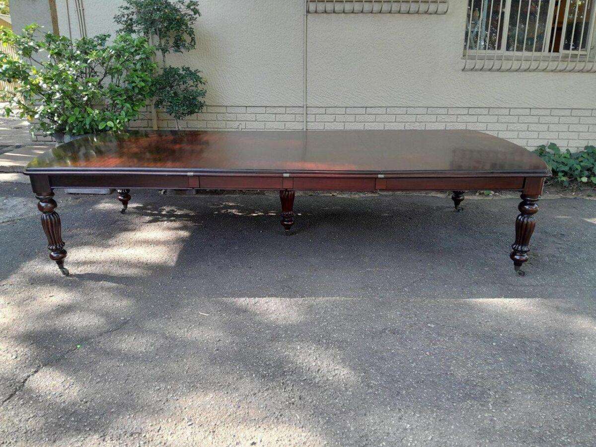 An Antique and Massive Victorian Mahogany Extending Table with Two Extensions and Original Castor...