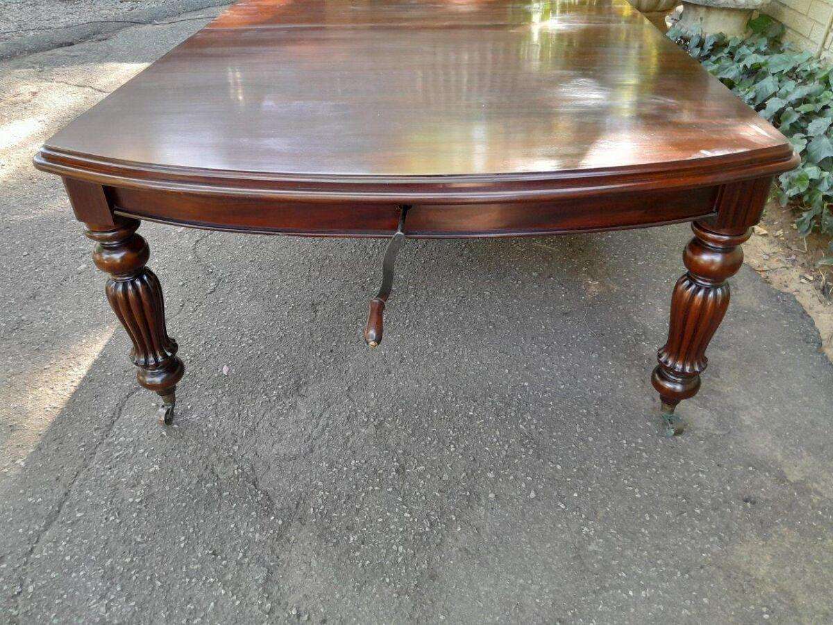 An Antique and Massive Victorian Mahogany Extending Table with Two Extensions and Original Castor...