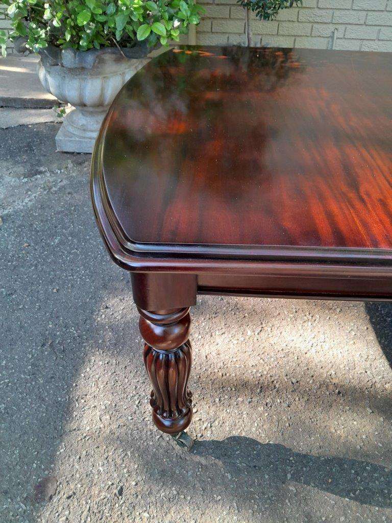 An Antique and Massive Victorian Mahogany Extending Table with Two Extensions and Original Castor...