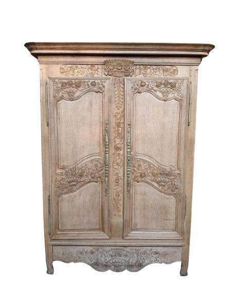 A 19th Century French Carved Oak Armoire With Drawers And Shelves