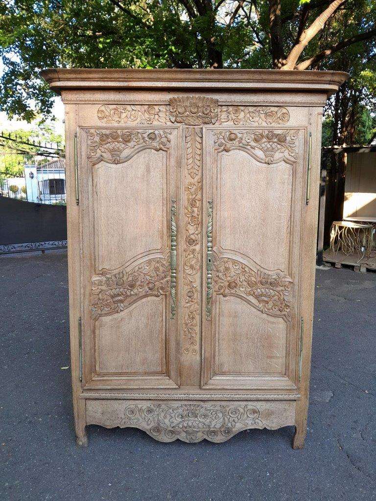 A 19th Century French Carved Oak Armoire With Drawers And Shelves