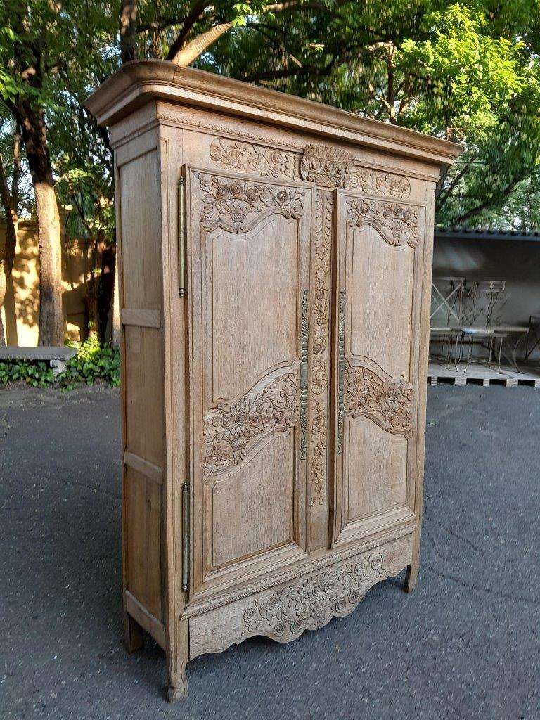 A 19th Century French Carved Oak Armoire With Drawers And Shelves