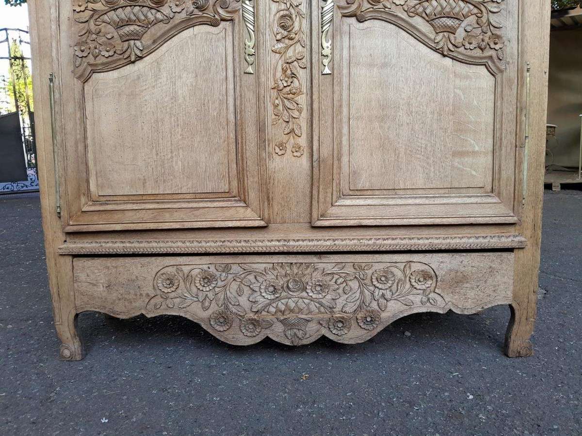 A 19th Century French Carved Oak Armoire With Drawers And Shelves