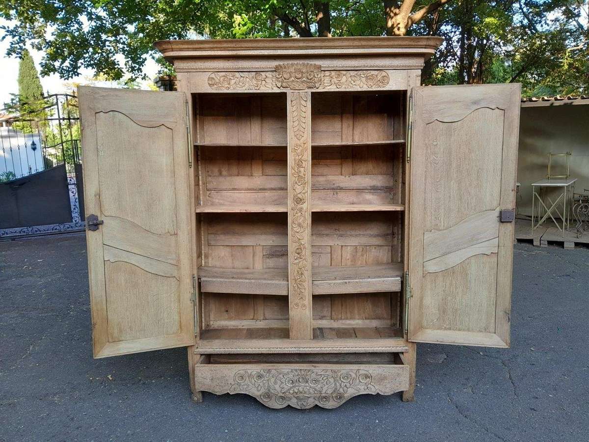 A 19th Century French Carved Oak Armoire With Drawers And Shelves
