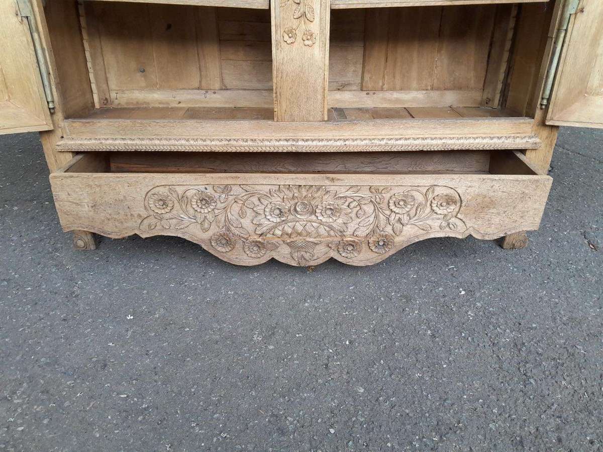 A 19th Century French Carved Oak Armoire With Drawers And Shelves