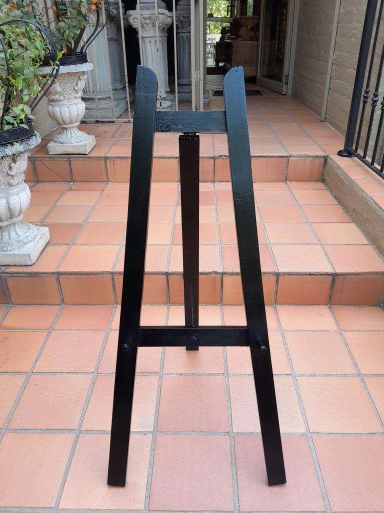 A Decorative Wooden Display Easel In An Ebonized Contemporary Finish
